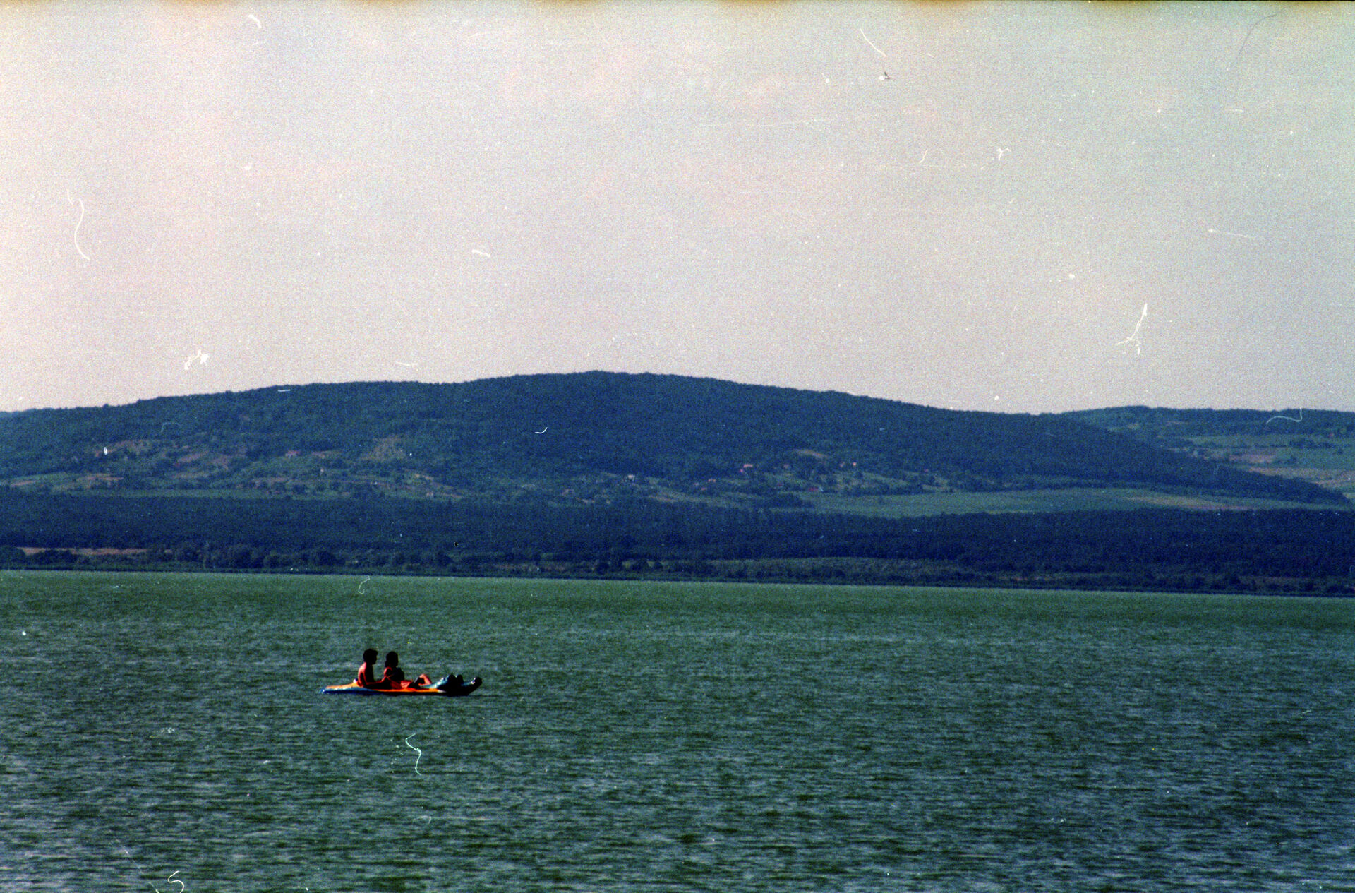 Couple kayaking together on a calm lake